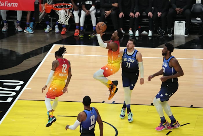 Feb 19, 2023; Salt Lake City, UT, USA; Team Giannis guard Donovan Mitchell (45) goes to the basket during the second half past Team LeBron forward Luka Doncic (77) in the 2023 NBA All-Star Game at Vivint Arena. Mandatory Credit: Kirby Lee-USA TODAY Sports